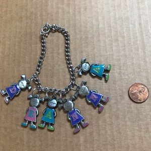 charm bracelet spelling “DEANNA”